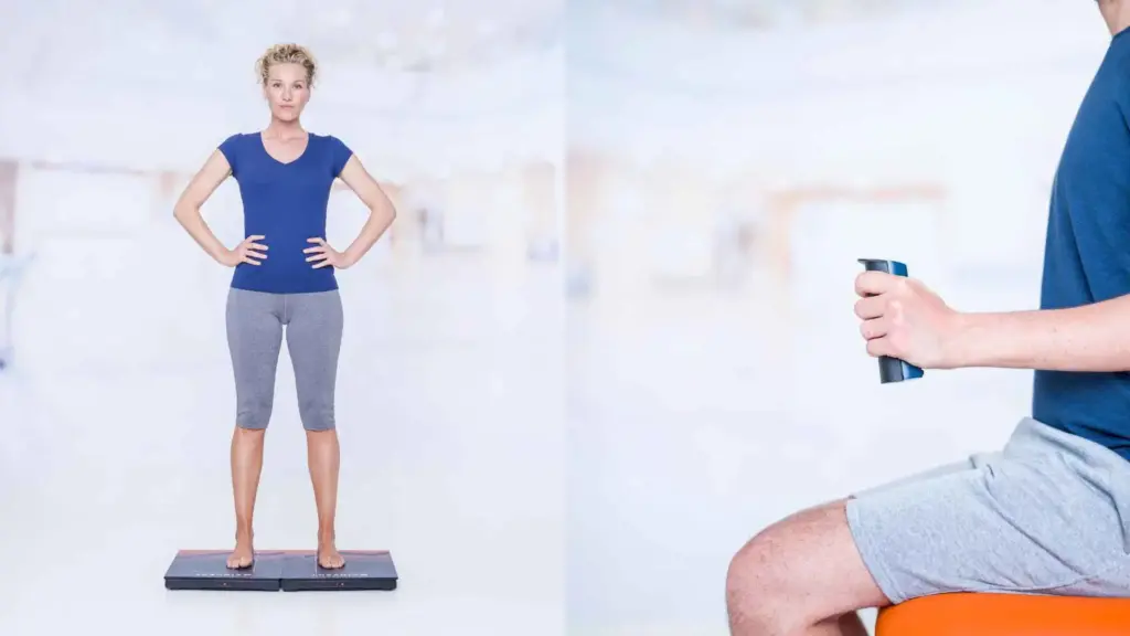 Patient performing an objective balance assessment on force plates during cardiac rehabilitation and a grip strength test with a grip dynamometer
