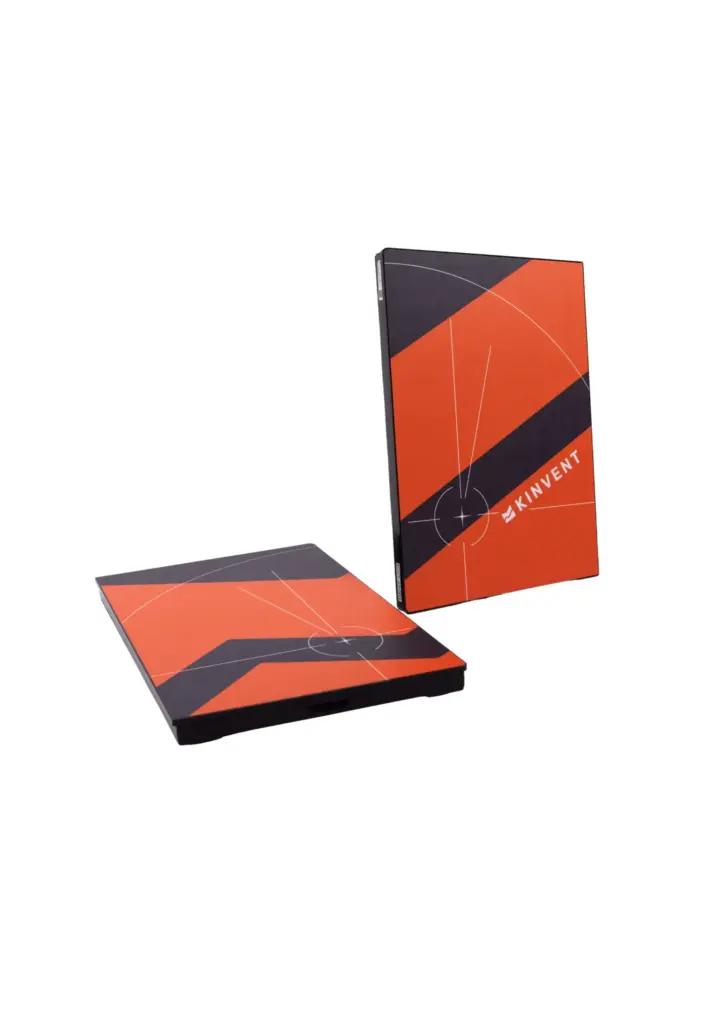 A pair of orange and black Kinvent K-Deltas force plates designed for biomechanical and athletic performance analysis