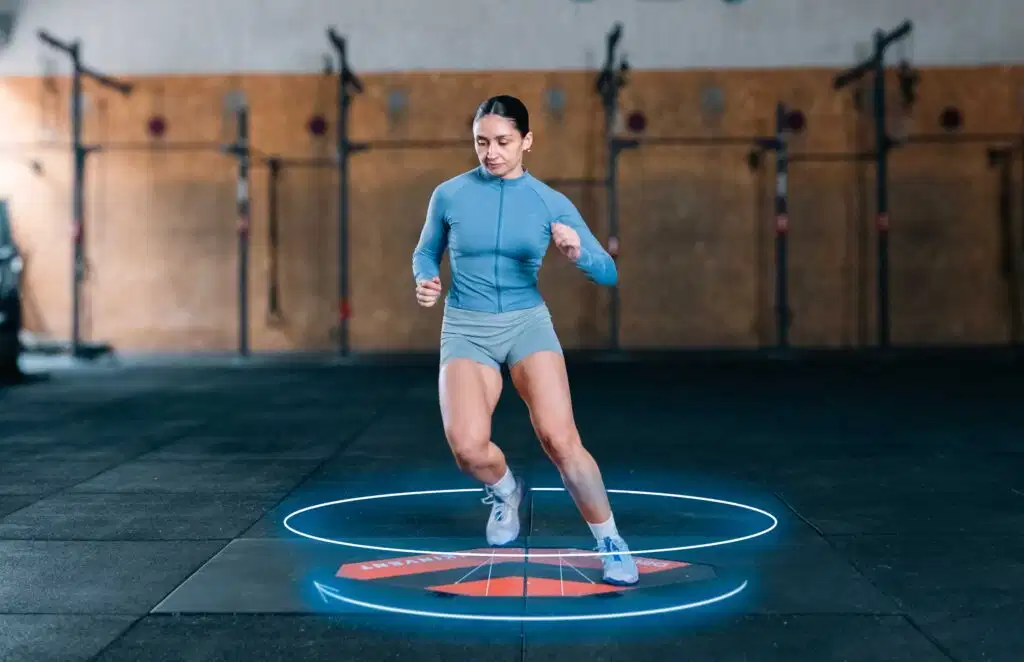 3D Deltas 43 A female athlete performing a dynamic change of direction test on Kinvent 3D force plates inside a gym during a return-to-play assessment