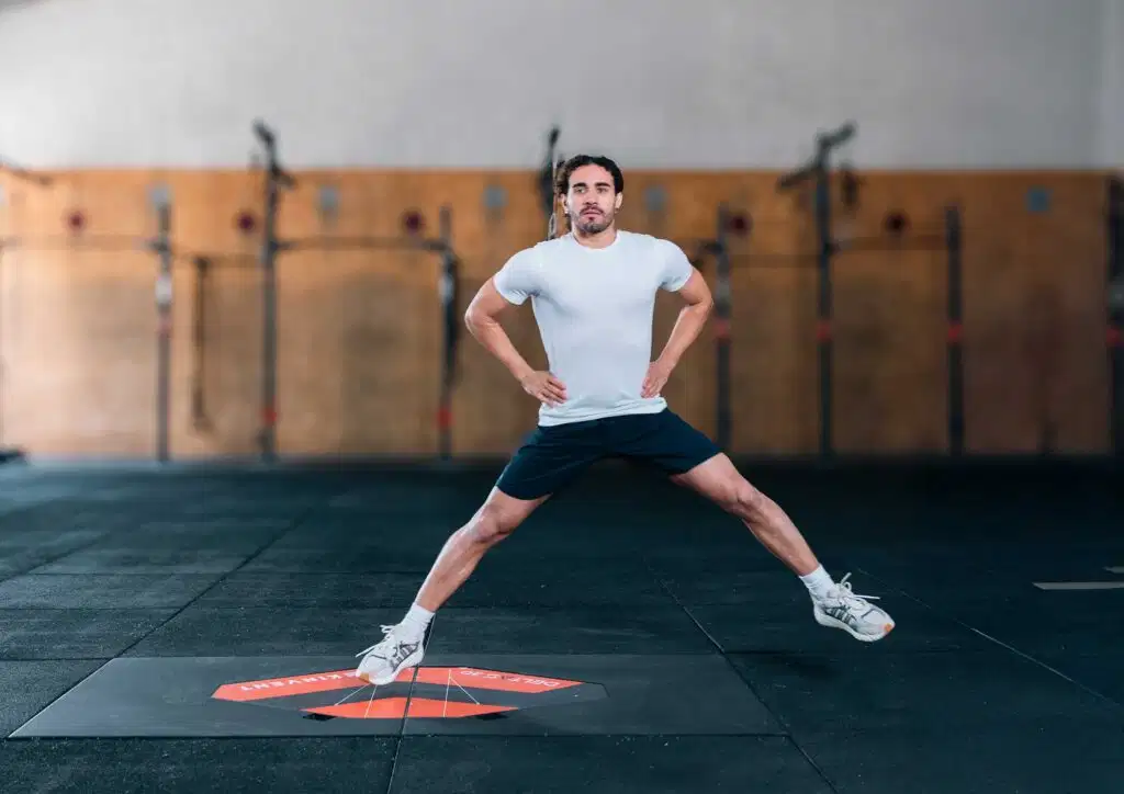ACL Rehabilitation: Why Objectivity is the Key to a Successful Return to Play? 5 Athlete performing a dynamic lateral bound on the Kinvent DELTAS 3D force plate to analyze horizontal and lateral forces